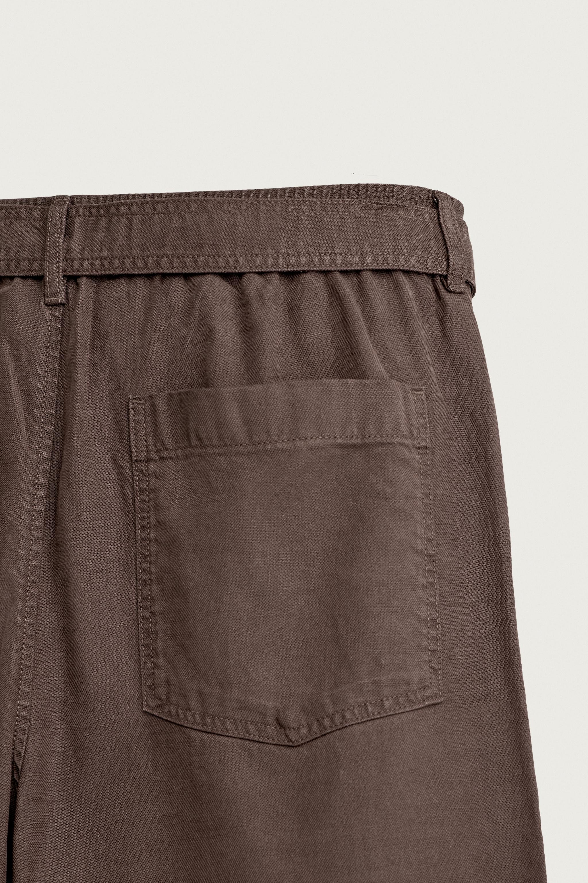 RELAXED FIT BELTED PLEATED PANTS